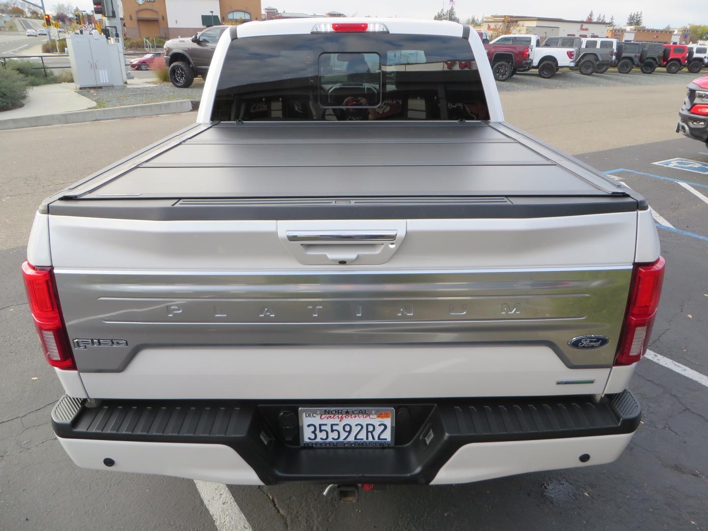 2019 White /BLACK INT W/DARK MARSALA LT Ford F-150 Platinum SuperCrew Cab 4WD (1FTEW1E45KF) with an 3.5L V6 ECOBOOST engine, 10-SPEED AUTO W/TOW MO transmission, located at 2630 Grass Valley Highway, Auburn, CA, 95603, (530) 508-5100, 38.937893, -121.095482 - F150 Platinum featuring a level kit, Fuel Offroad wheels, Toyo AT2 tires, Barricade Front winch bumper, Smittybilt winch, LED light bar, Undercover Ultraflex bedcover, and a Cargo Glide bed system. - Photo#11